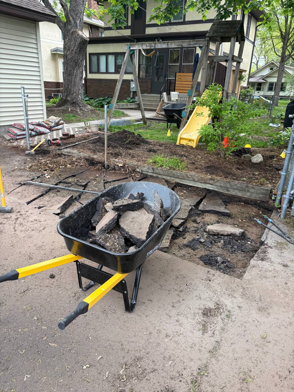 Demolition debris pile staged for haul-out, broken concrete and wood, Minneapolis