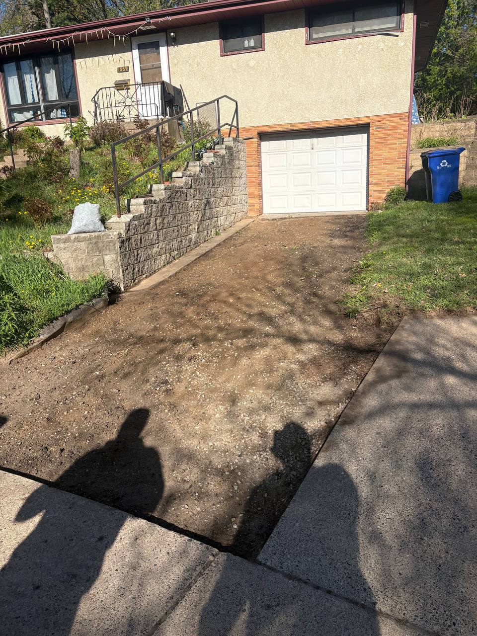 Concrete driveway removed at split-level home, graded smooth and ready for new pour, Twin Cities