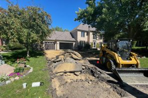 Driveway demolition with skid steer Minneapolis MN