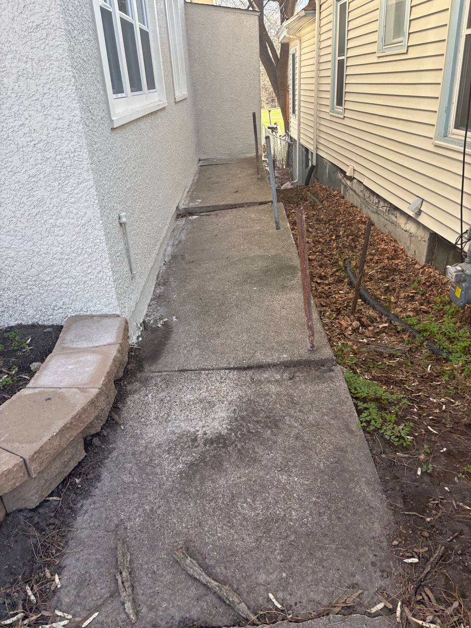 Existing residential concrete walkway between homes during free on-site estimate, Minneapolis