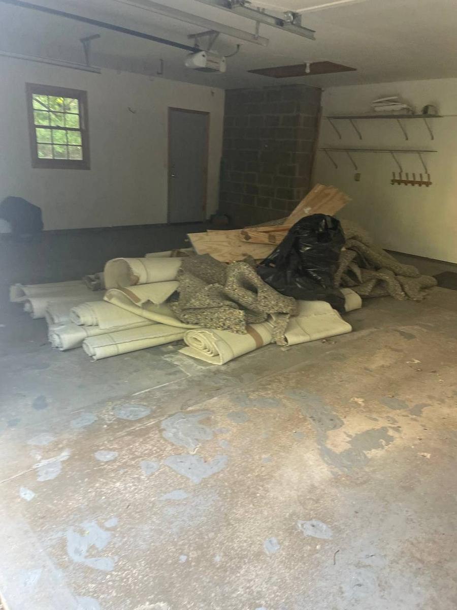 Twin Cities Concrete Demolition dump trailer loaded with interior demo debris on commercial jobsite