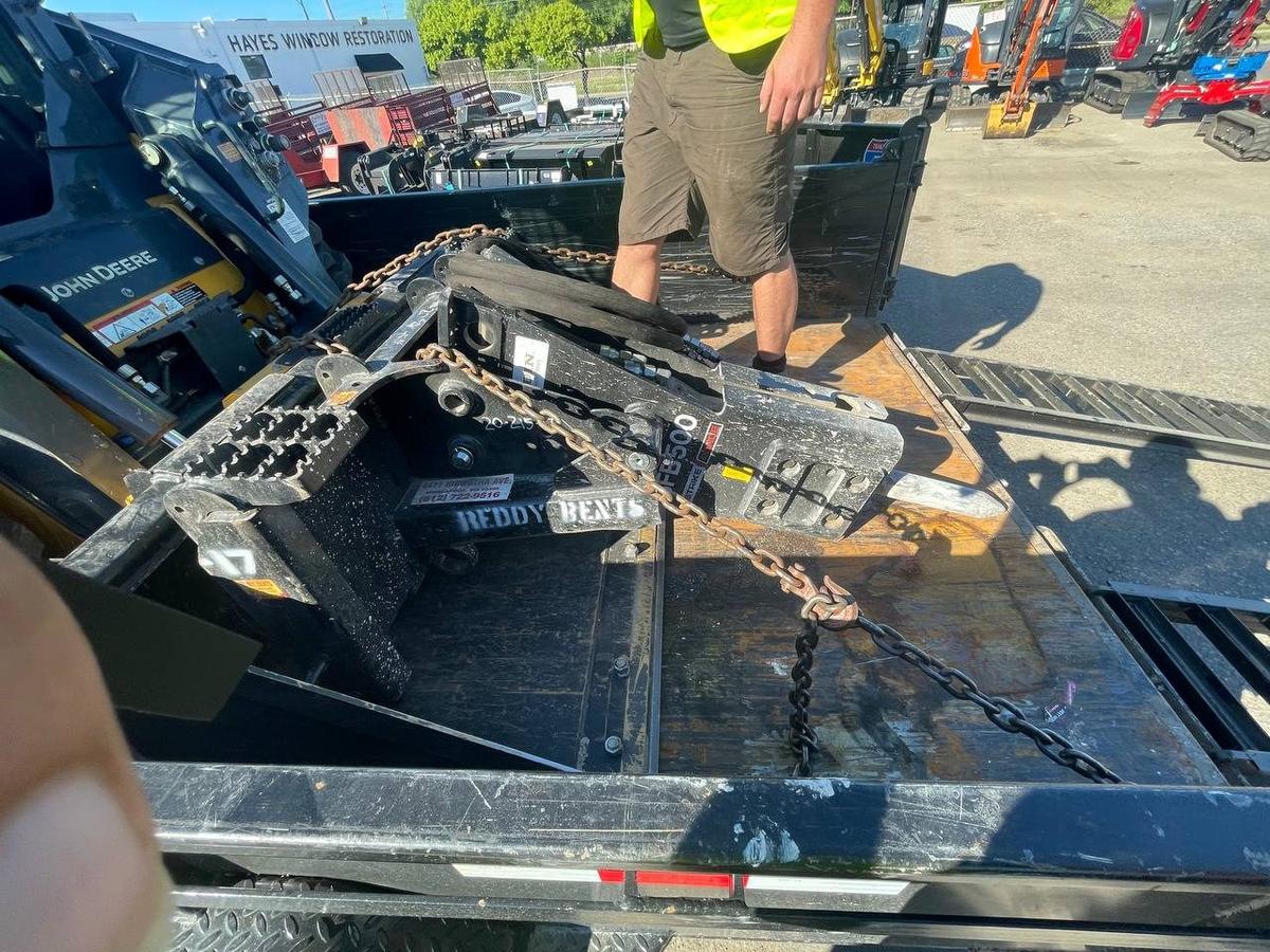 John Deere skid steer with demolition attachment on Twin Cities Concrete Demolition trailer